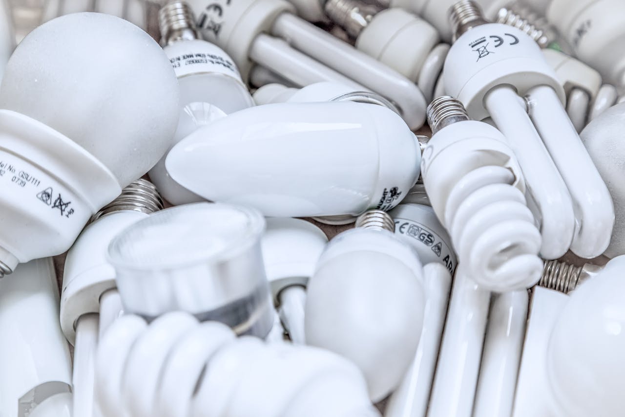 services-01 Pile of diverse energy-efficient light bulbs showcasing an array of designs and functionalities.